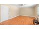 Bedroom showing wood floors, a ceiling fan, and a sunlit window at 2871 Milstead St, Orlando, FL 32837