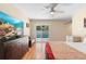 Bedroom featuring sliding glass doors, ceiling fan, laminate wood flooring and natural light at 2871 Milstead St, Orlando, FL 32837