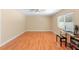 Bedroom featuring hardwood floors, a ceiling fan, and a sunlit window at 2871 Milstead St, Orlando, FL 32837