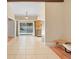 This dining area features an open layout with views of the pool area, neutral paint, and tile flooring at 2871 Milstead St, Orlando, FL 32837