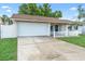 Charming single-story home with a two-car garage, well-maintained lawn, and picket fence at 2871 Milstead St, Orlando, FL 32837