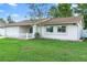 Charming single-story home with a well-manicured lawn and a two-car garage at 2871 Milstead St, Orlando, FL 32837