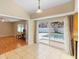View from kitchen to outdoor pool, laminate flooring, and recessed lighting at 2871 Milstead St, Orlando, FL 32837