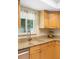 Kitchen details featuring granite countertops, a stainless steel dishwasher, and updated sink faucet at 2871 Milstead St, Orlando, FL 32837