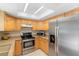 Bright kitchen featuring granite countertops, stainless steel appliances, and a skylight at 2871 Milstead St, Orlando, FL 32837