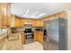 Bright kitchen featuring granite countertops, stainless steel appliances, and a skylight at 2871 Milstead St, Orlando, FL 32837
