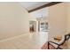 Bright living room with tile floors, vaulted ceiling, and a view of the pool through sliding glass doors at 2871 Milstead St, Orlando, FL 32837