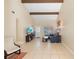 Inviting living room boasts tile flooring, high ceilings with wood beams, and neutral paint at 2871 Milstead St, Orlando, FL 32837