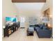 Bright living room featuring tile flooring, high ceilings, and a comfortable seating area at 2871 Milstead St, Orlando, FL 32837