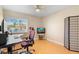 Office space with laminate wood flooring, ample natural light, and an ergonomic workspace at 2871 Milstead St, Orlando, FL 32837