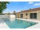 Backyard pool with a freshly painted deck and a view of the home's exterior at 2871 Milstead St, Orlando, FL 32837