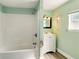 Bathroom featuring a tub/shower combo and a white vanity at 318 Palm St, New Smyrna Beach, FL 32168