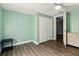 Bedroom features wood look vinyl flooring and large closet at 318 Palm St, New Smyrna Beach, FL 32168