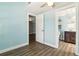Bedroom with light blue walls and wood look vinyl flooring at 318 Palm St, New Smyrna Beach, FL 32168