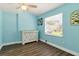 Bedroom featuring a large window and wood look vinyl flooring at 318 Palm St, New Smyrna Beach, FL 32168