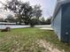 View of a large backyard with grass, white fence, and mature trees at 358 2Nd St, Geneva, FL 32732