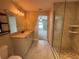 Bathroom featuring a vanity, mirror, walk-in shower, and doorway to a bedroom at 358 2Nd St, Geneva, FL 32732