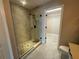 Bathroom featuring a glass shower with tile surround and a view into the walk-in closet at 358 2Nd St, Geneva, FL 32732