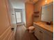 Bathroom featuring wood-look tile floor, vanity and a shower/tub combo at 358 2Nd St, Geneva, FL 32732