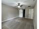 Bedroom featuring neutral walls, carpet flooring, a ceiling fan, and a sliding barn door at 358 2Nd St, Geneva, FL 32732