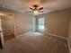 Bedroom featuring a ceiling fan, window, and doorway to another room at 358 2Nd St, Geneva, FL 32732