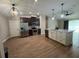 Open kitchen with stainless steel appliances, dark cabinetry, and a large island at 358 2Nd St, Geneva, FL 32732