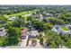 Aerial shot of the property showcasing mature landscaping and a nearby golf course at 3637 Dubsdread Cir, Orlando, FL 32804