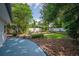Spacious backyard with lush lawn and manicured landscaping at 3637 Dubsdread Cir, Orlando, FL 32804