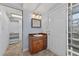 Bathroom features a stylish vanity, tile floors, and a closet space at 3637 Dubsdread Cir, Orlando, FL 32804