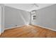 Bright and airy bedroom with hardwood floors, a ceiling fan, and a large window at 3637 Dubsdread Cir, Orlando, FL 32804