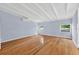 Large bedroom featuring hardwood floors, large windows and natural light at 3637 Dubsdread Cir, Orlando, FL 32804
