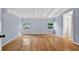 Bright bedroom featuring hardwood floors and two large windows at 3637 Dubsdread Cir, Orlando, FL 32804