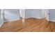 Bedroom featuring wood floors and access to an ensuite bathroom at 3637 Dubsdread Cir, Orlando, FL 32804