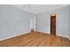 Inviting bedroom with wood floors and an open closet space at 3637 Dubsdread Cir, Orlando, FL 32804