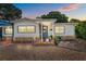 Charming single-Gathering home featuring neutral siding, stone accents, and a welcoming front entrance at 3637 Dubsdread Cir, Orlando, FL 32804