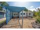 Quaint single-Gathering home featuring neutral siding, stone accents, and a detached blue carport at 3637 Dubsdread Cir, Orlando, FL 32804