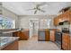 This modern kitchen has stainless steel appliances, tile floors, granite counters, and lots of storage at 3637 Dubsdread Cir, Orlando, FL 32804