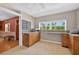 Kitchen nook with wood cabinets, a large window, and tile floors at 3637 Dubsdread Cir, Orlando, FL 32804