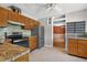 Well-lit kitchen showcasing granite countertops, stainless steel appliances, and wooden cabinets, offering a clean and functional space at 3637 Dubsdread Cir, Orlando, FL 32804