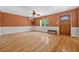 Inviting living room features hardwood floors, ceiling fan, and a sun-filled window at 3637 Dubsdread Cir, Orlando, FL 32804