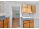 Pantry area features ample cabinet space and a view into another room, combining storage with accessibility at 3637 Dubsdread Cir, Orlando, FL 32804
