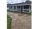 Charming single story home featuring a porch and a spacious driveway at 4 N Christiana Ave, Apopka, FL 32703