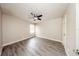 An empty bedroom features wood-style flooring, a ceiling fan, a window, and white walls at 420 Forestway Cir # 306, Altamonte Springs, FL 32701