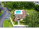 Aerial view of the clubhouse and pool with lush trees and parking spaces at 420 Forestway Cir # 306, Altamonte Springs, FL 32701