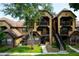 Charming condo complex with well-manicured landscaping, private balcony, and convenient stairway access to multiple units at 420 Forestway Cir # 306, Altamonte Springs, FL 32701