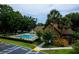 Community pool and spa surrounded by trees and landscaping at 420 Forestway Cir # 306, Altamonte Springs, FL 32701