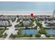 Overhead view of the neighborhood, beach, tennis courts, and blue ocean at 4365 S Atlantic Ave # B8, New Smyrna Beach, FL 32169