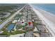 Aerial view of neighborhood featuring private community pools, tennis courts, and beach at 4365 S Atlantic Ave # B8, New Smyrna Beach, FL 32169