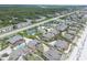Expansive aerial shot showcasing the coastal community near the beach with tennis courts at 4365 S Atlantic Ave # B8, New Smyrna Beach, FL 32169