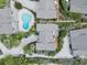 Birds-eye view of a property with a pool, decks, and well-manicured landscaping at 4365 S Atlantic Ave # B8, New Smyrna Beach, FL 32169